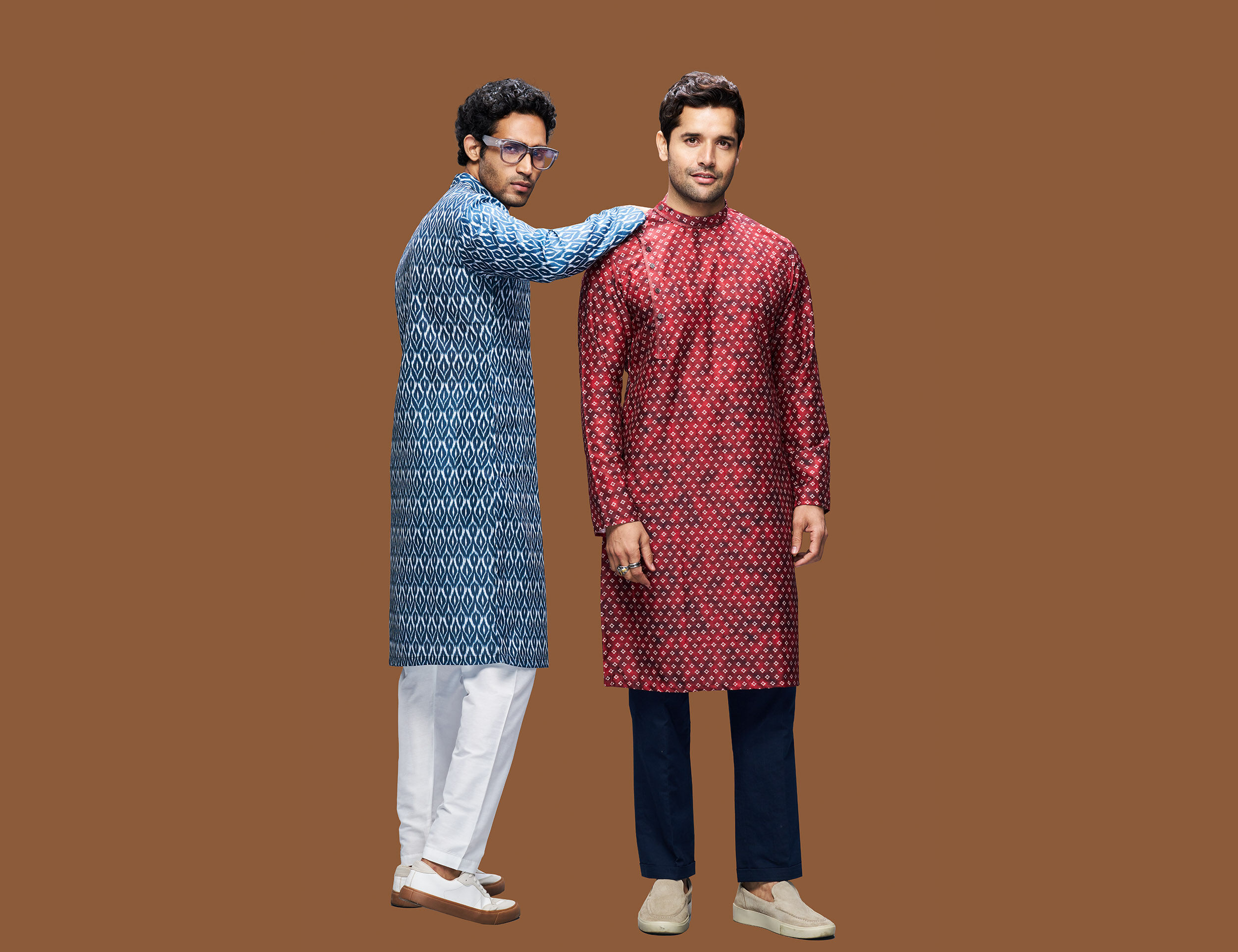 Men in printed kurtas with clean minimalist sneakers for festive wear, smart-casual ethnic outfits, and contemporary men's Indian fashion